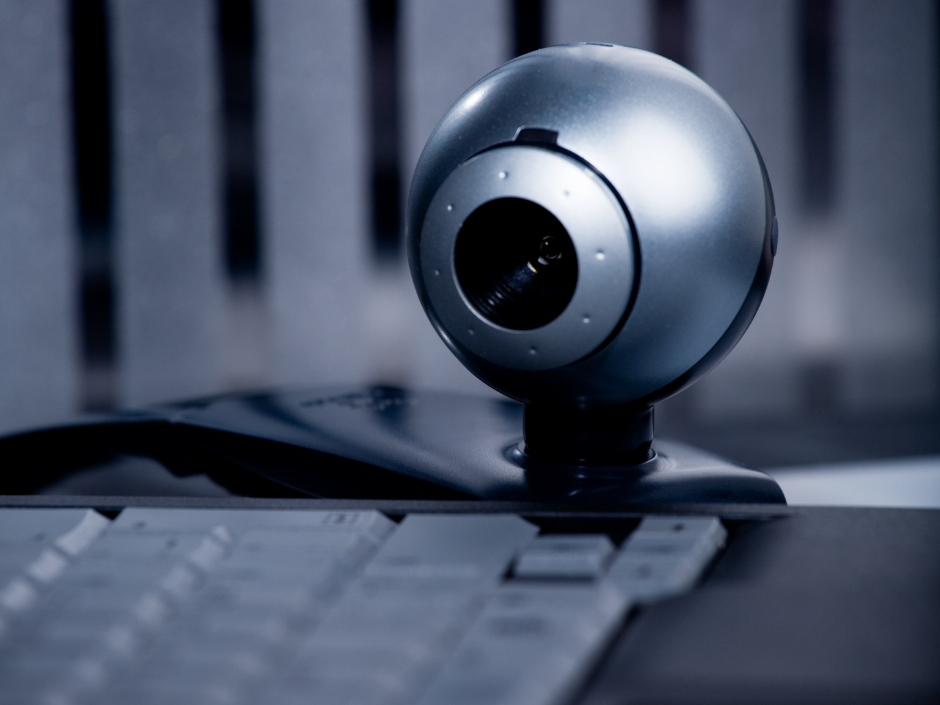 Image of a camera pointed at a keyboard.