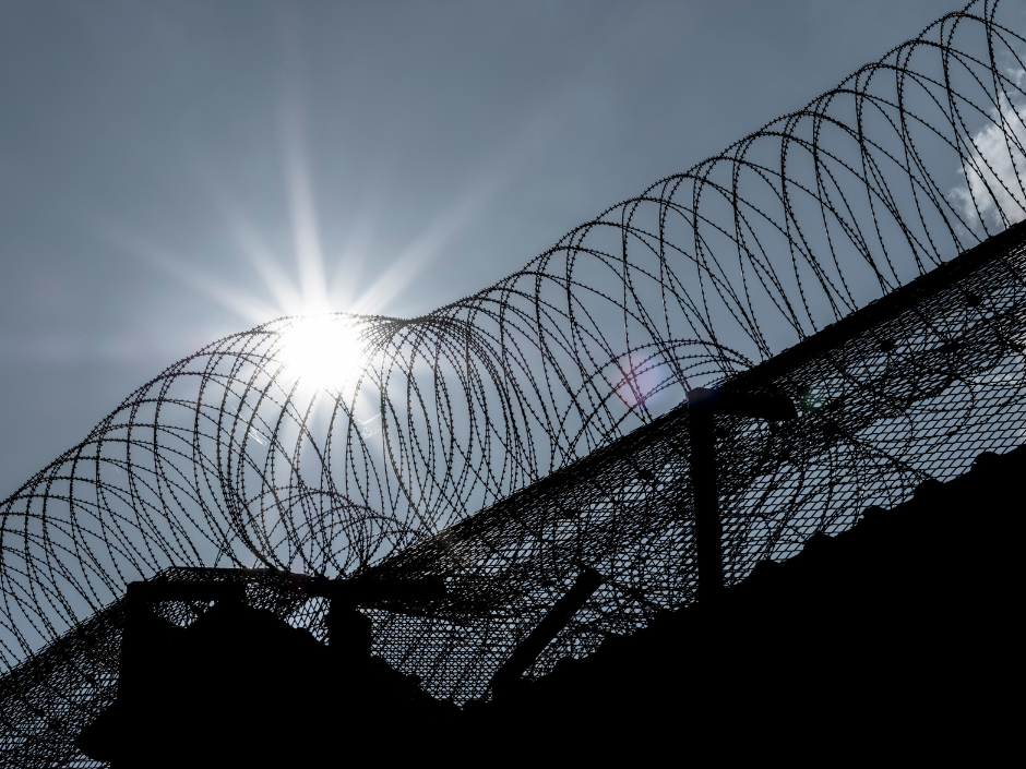 Image of a barbed wire fence and barrier.