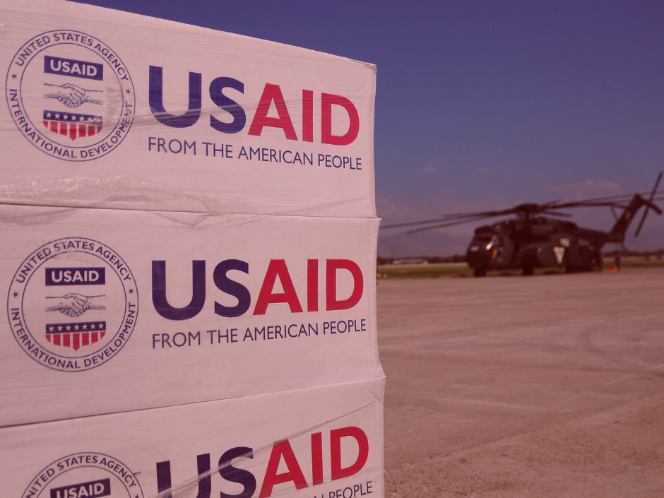 Image of USAID boxes with a red filter.