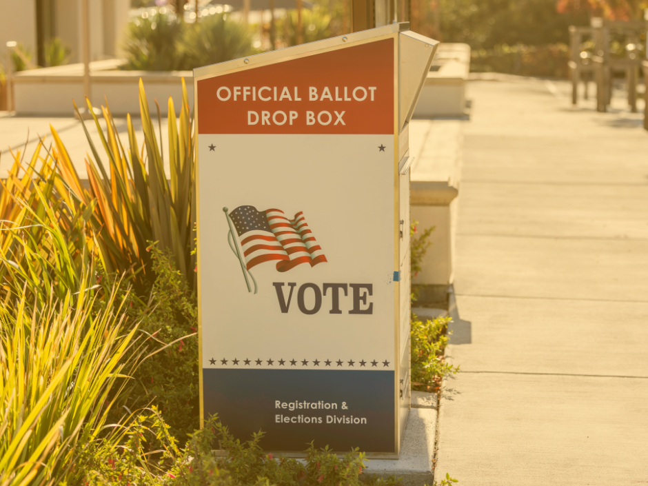 Image of a ballot drop box with a yellow filter.