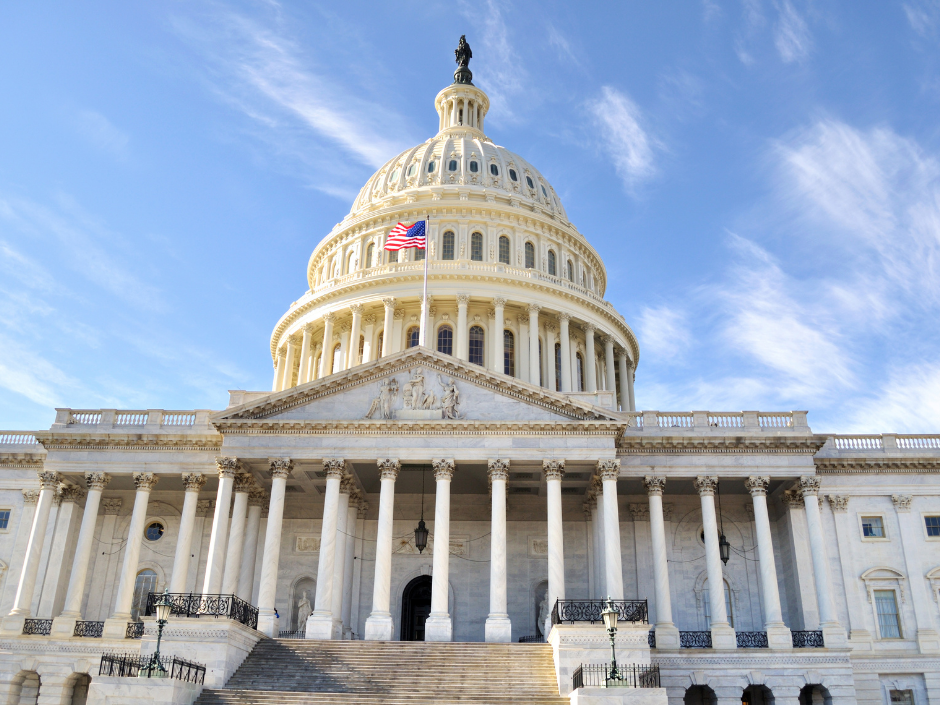 Image of the U.S. Capitol against a blue sky.