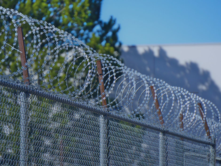 Image of a barbed fire fence.