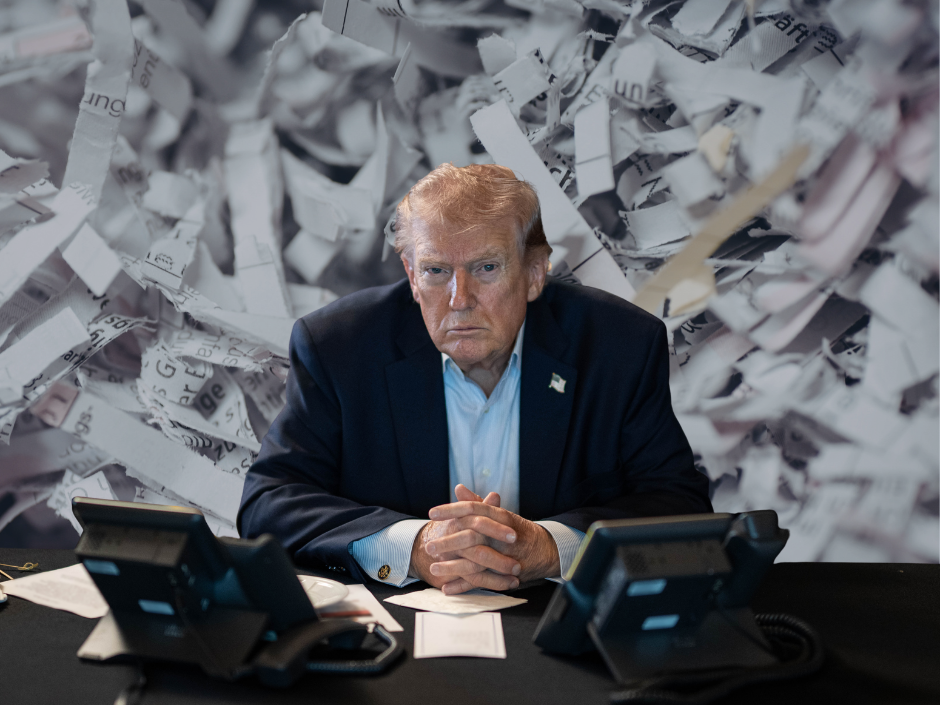Donald Trump in front of shredded documents.